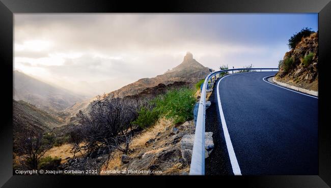 Roque Bentayga seen from the road on a beautiful and misty day Framed Print by Joaquin Corbalan