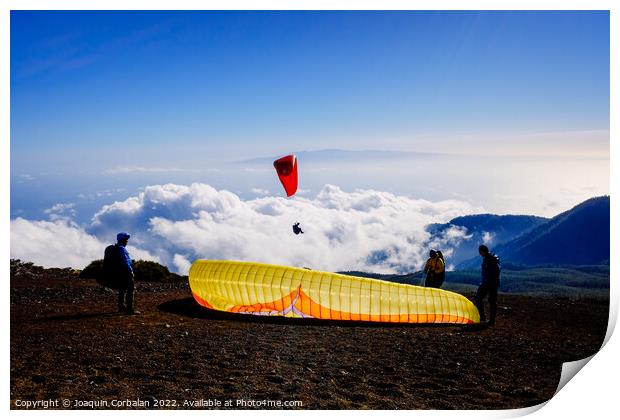 Skydiving experts and monitors prepare the sail of a paraglider  Print by Joaquin Corbalan