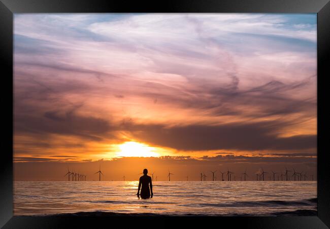 Iron Man watching the sunset Framed Print by Jason Wells