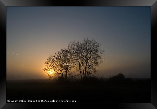 Misty Sunset. Framed Print by Nigel Bangert