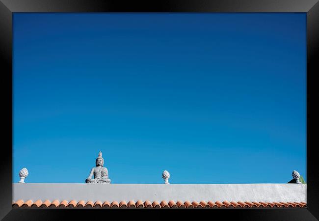 Buddha figure on roof Framed Print by Phil Crean