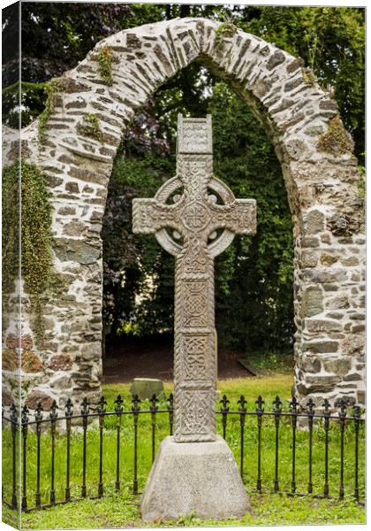 Celtic cross and stone arch Ireland Canvas Print by Phil Crean