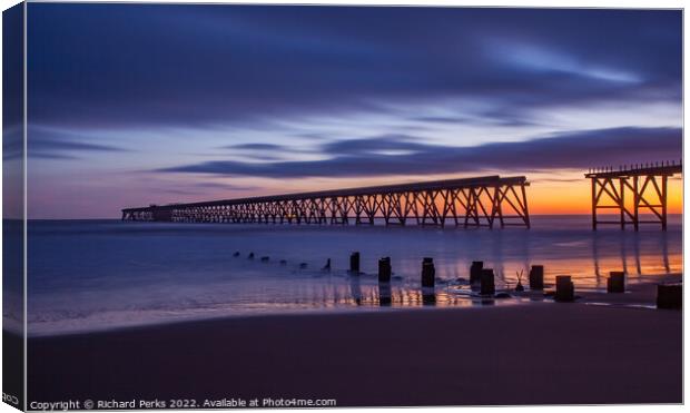 A Glowing Sunrise at Steetley Pier Canvas Print by Richard Perks