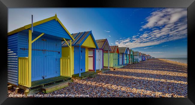 Colourful Beach Huts on Herne Bay beach Kent Framed Print by John Gilham