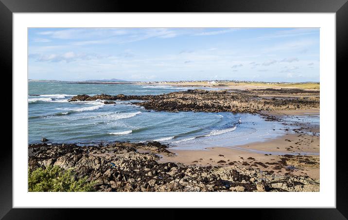 Waves lap against Porth Trecastell Framed Mounted Print by Jason Wells
