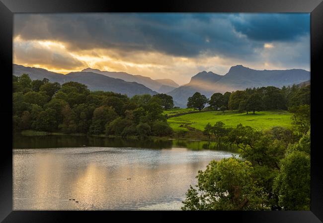 Sunset over Loughrigg Tarn in Lake District Framed Print by Steve Heap