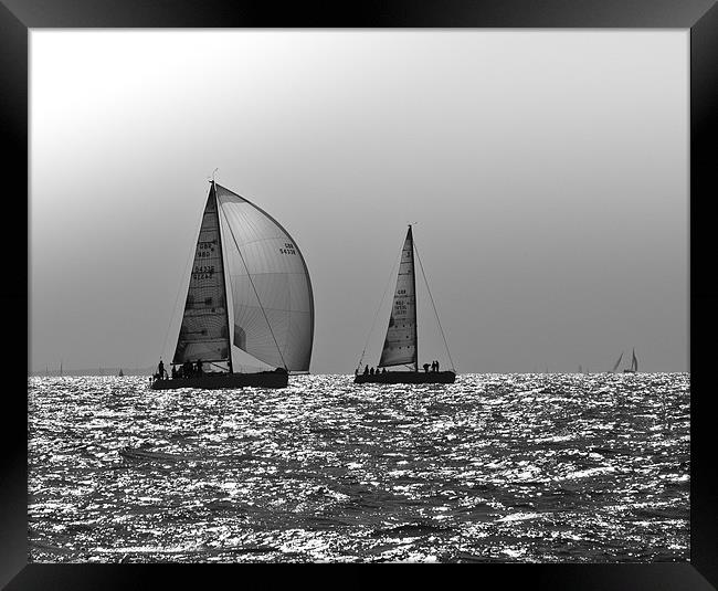 Yachts heading home, Solent Framed Print by Gary Eason
