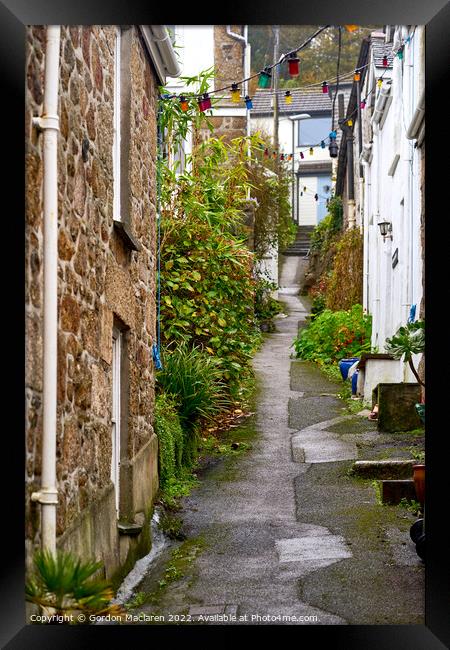 Picturesque street in Mousehole, Cornwall Framed Print by Gordon Maclaren