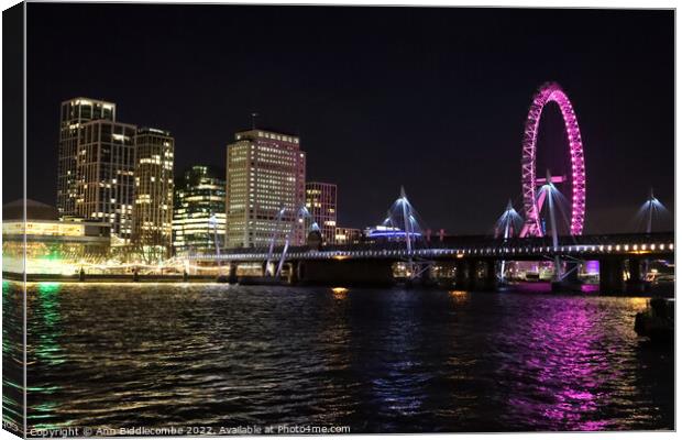 London view from side of river Thames at night Canvas Print by Ann Biddlecombe