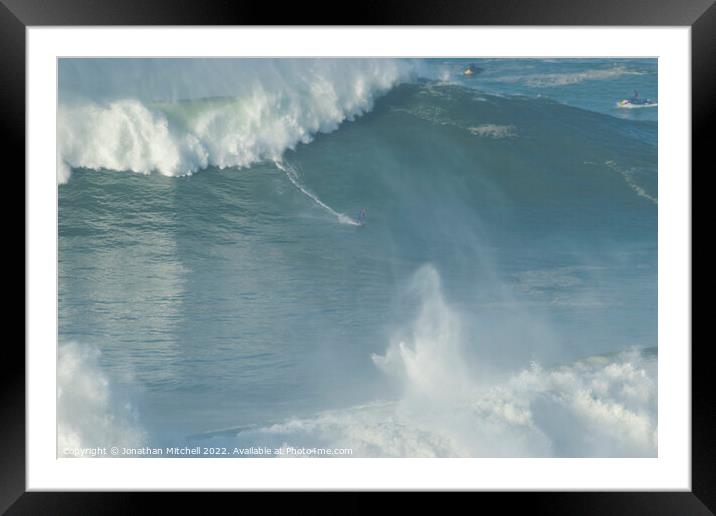 Surfer on a XXL wave at Nazare Portugal Framed Mounted Print by Jonathan Mitchell