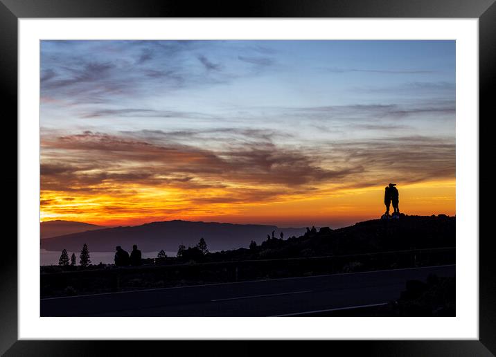 Tourists watch dramatic sunset from Tenerife Framed Mounted Print by Phil Crean