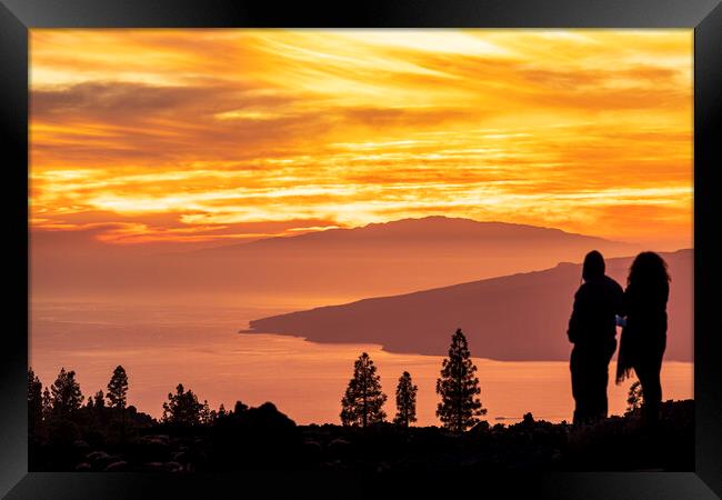 Tourists watch dramatic sunset from Tenerife Framed Print by Phil Crean