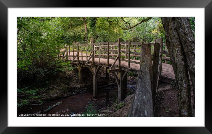 Pooh Sticks Bridge located in the One Hundred Acre woods in the stories Framed Mounted Print by George Robertson