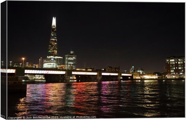 Reflections on the Thames Canvas Print by Ann Biddlecombe