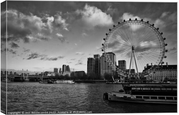 Monochrome the London eye and boats on the Thames Canvas Print by Ann Biddlecombe