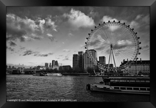 Monochrome the London eye and boats on the Thames Framed Print by Ann Biddlecombe