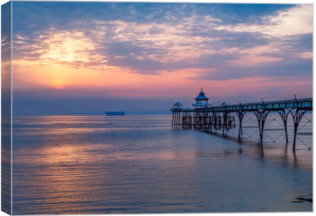 Clevedon Pier with vessel heading to Bristol docks Canvas Print by Rory Hailes
