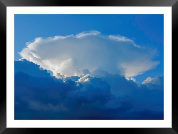 Large cumulus cloud against a blue sky Framed Mounted Print by Rory Hailes