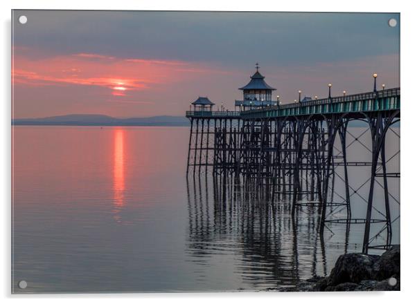 Clevedon Pier at sunset with it legs reflecting in the sea Acrylic by Rory Hailes