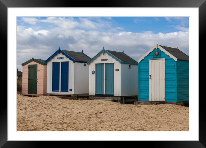 A Colourful Array of Beach Huts Framed Mounted Print by Kevin Snelling