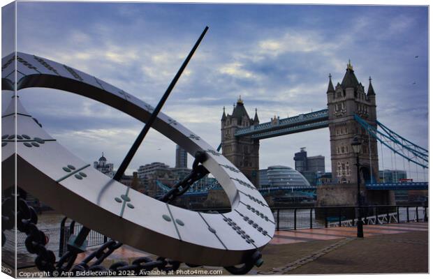 Sundial with tower bridge Canvas Print by Ann Biddlecombe