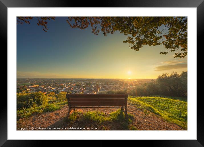 Bench and Pietrasanta panoramic view at sunset, Versilia, Lucca, Framed Mounted Print by Stefano Orazzini