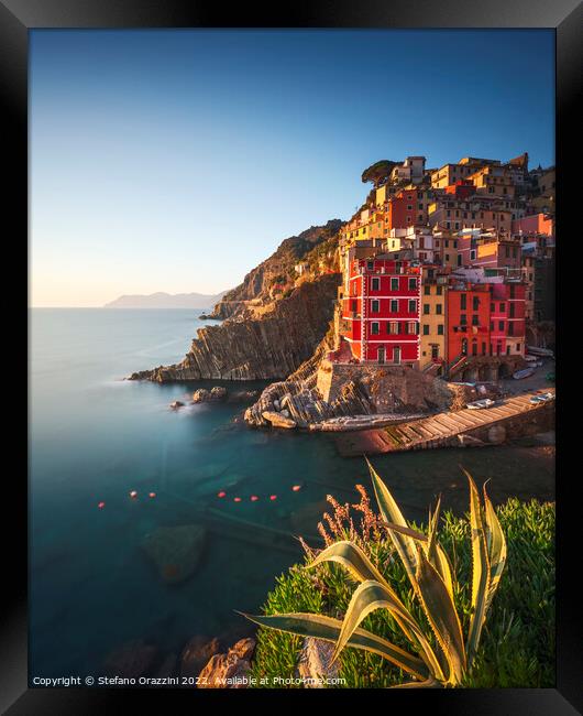 Riomaggiore town, cape and sea at sunset. Cinque Terre, Liguria, Framed Print by Stefano Orazzini