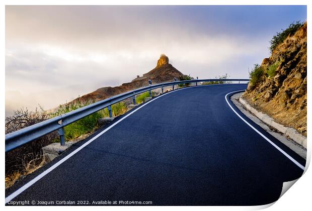 A mountain road approaches the famous Roque Bentayga through the Print by Joaquin Corbalan