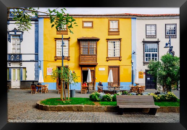  Colorful facades in the streets of the old town of San cristoba Framed Print by Joaquin Corbalan