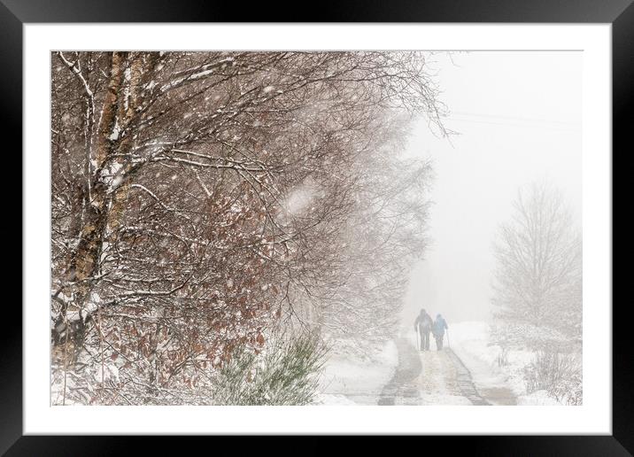 Walking in Snow Framed Mounted Print by chris smith