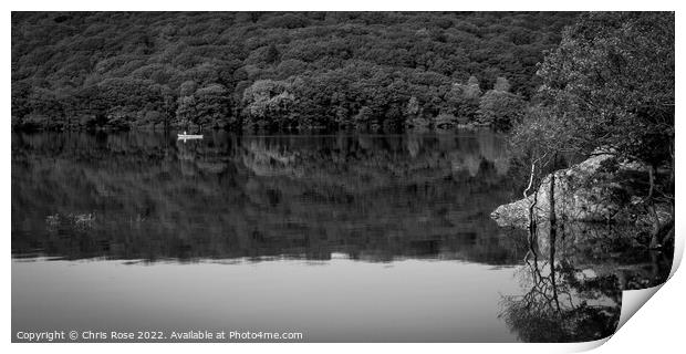 A couple pass in a canoe on Coniston Water Print by Chris Rose