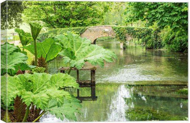 River Eye with footbridge at Lower Slaughter Cotswolds Canvas Print by Nick Jenkins
