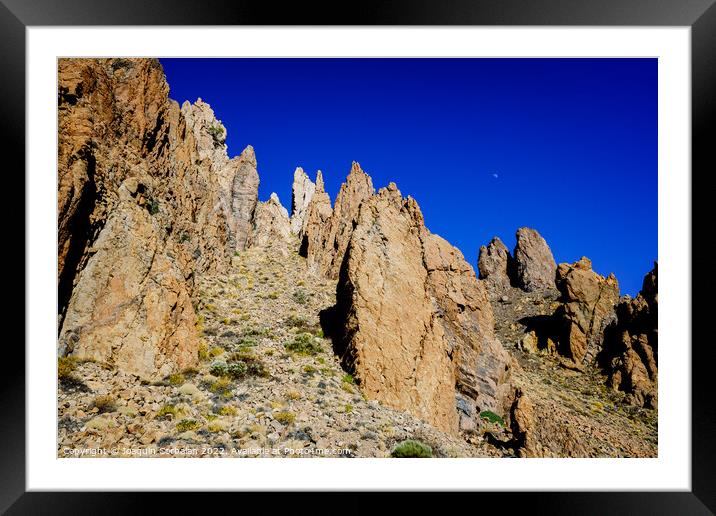 vertical rock stone formations on a bright sky sunny day Framed Mounted Print by Joaquin Corbalan