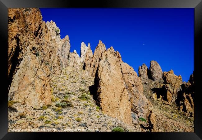 vertical rock stone formations on a bright sky sunny day Framed Print by Joaquin Corbalan