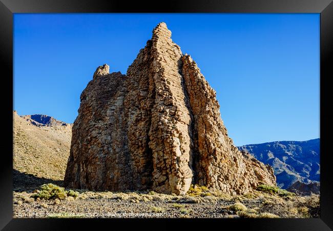 vertical rock stone formations on a bright sky sunny day Framed Print by Joaquin Corbalan