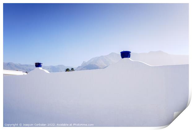 A sunny day to see the mountains behind the whitewashed wall of  Print by Joaquin Corbalan