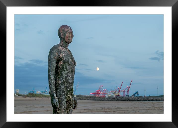 Moon behind an Iron Man Framed Mounted Print by Jason Wells