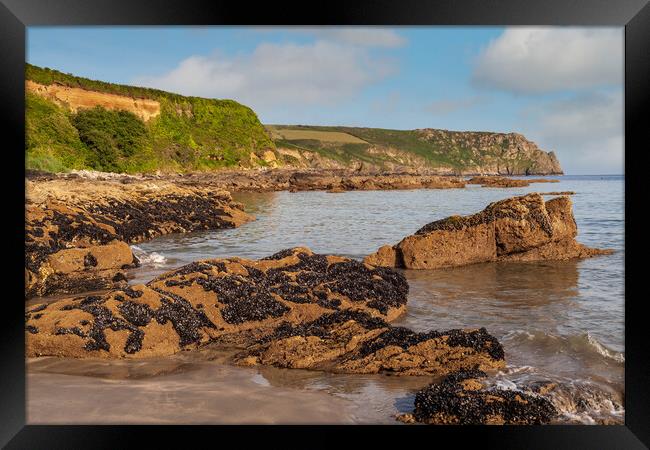A rocky beach at pendower cornwall Framed Print by Kevin Snelling
