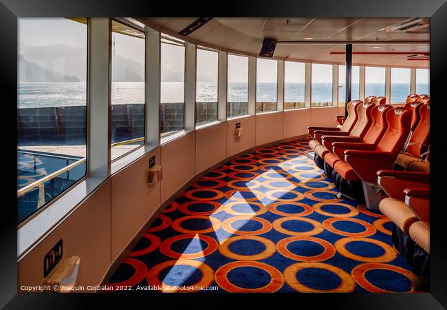Empty seats inside a maritime ferry for passengers, before saili Framed Print by Joaquin Corbalan