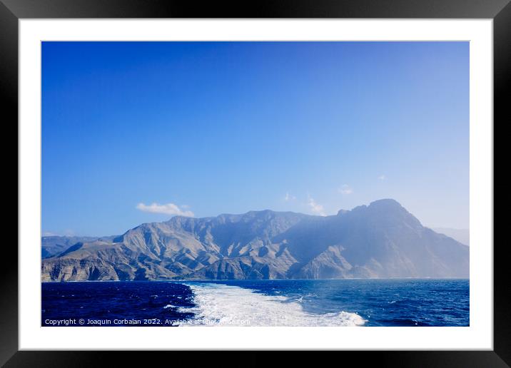 Tourists say goodbye to the island of high mountains on a sea vo Framed Mounted Print by Joaquin Corbalan
