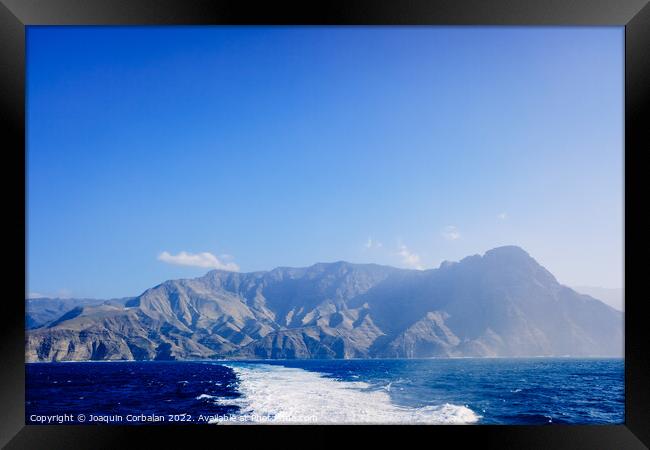 Tourists say goodbye to the island of high mountains on a sea vo Framed Print by Joaquin Corbalan