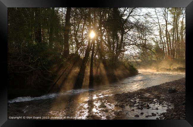 Sunrays across the river. Framed Print by Glyn Evans