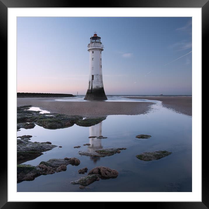 Perch Rock lighthouse reflection Framed Mounted Print by Ann Goodall