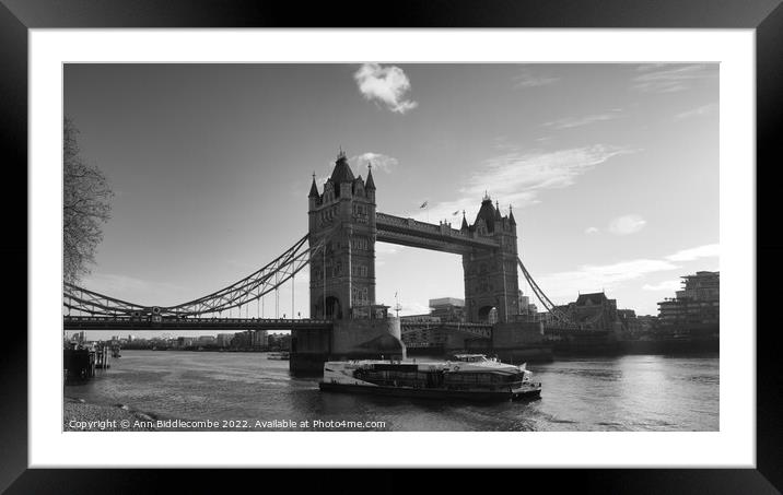 Monochrome tower bridge with tourist boat Framed Mounted Print by Ann Biddlecombe
