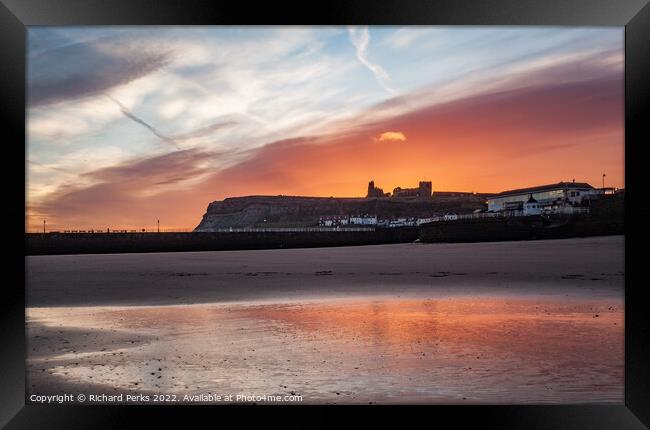 Fiery skies over Whitby Abbey Framed Print by Richard Perks