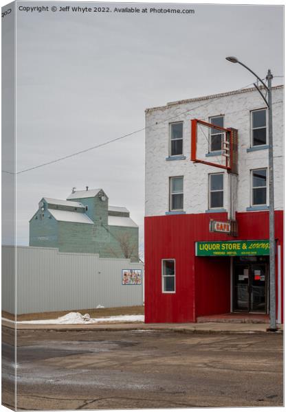  Small town storefronts in Trochu Canvas Print by Jeff Whyte