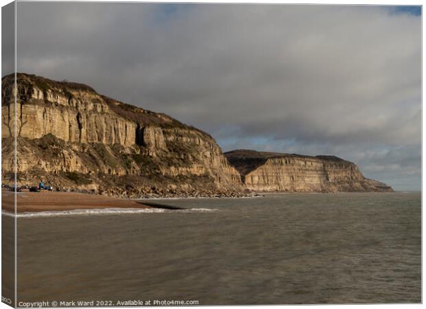 The Cliffs of Hastings on a Moody Day. Canvas Print by Mark Ward