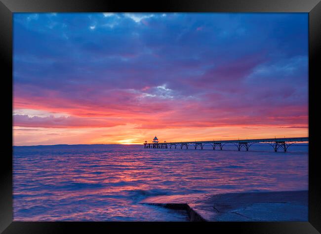 Clevedon Pier at sunset with a pinkish hue Framed Print by Rory Hailes