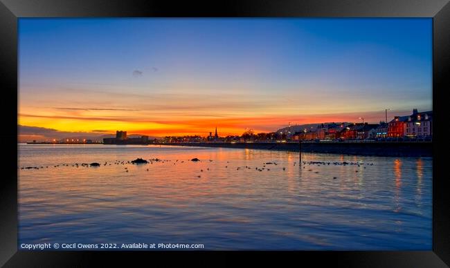 A sunset over Carrickfergus Castle Framed Print by Cecil Owens