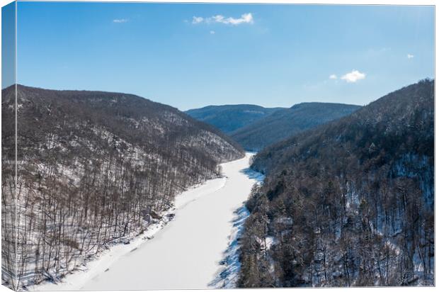 Aerial view up the frozen Cheat River in Morgantown, WV Canvas Print by Steve Heap